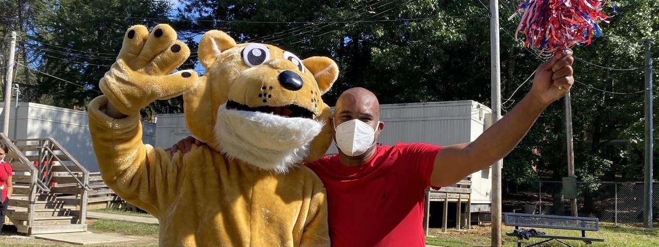 Principal McFarlane and the Chesnut Cougar at the Chesnut Challenge pep rally.  